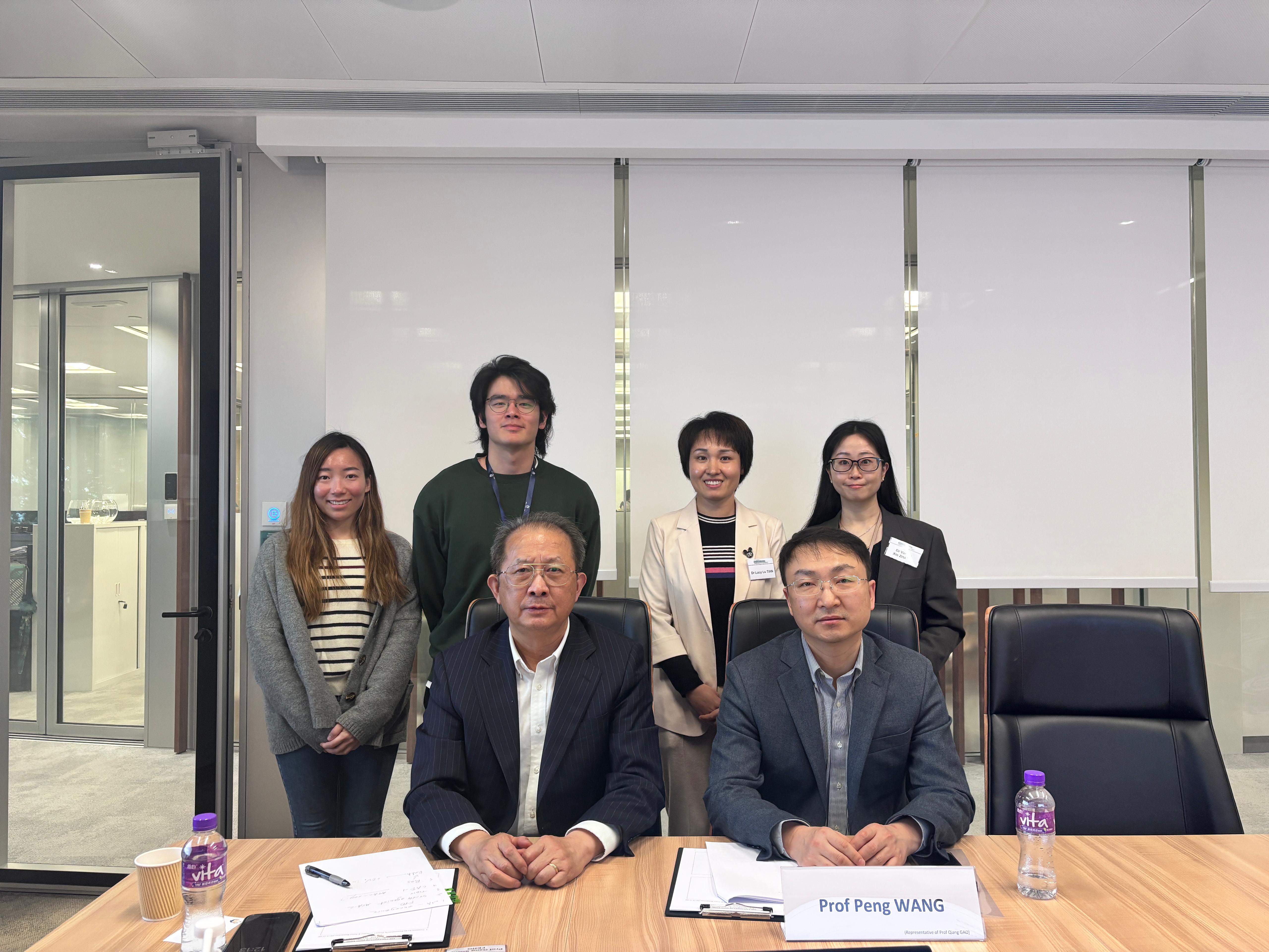 Professor Feng and Professor Wang, and the Postdoctoral Fellows of the Project